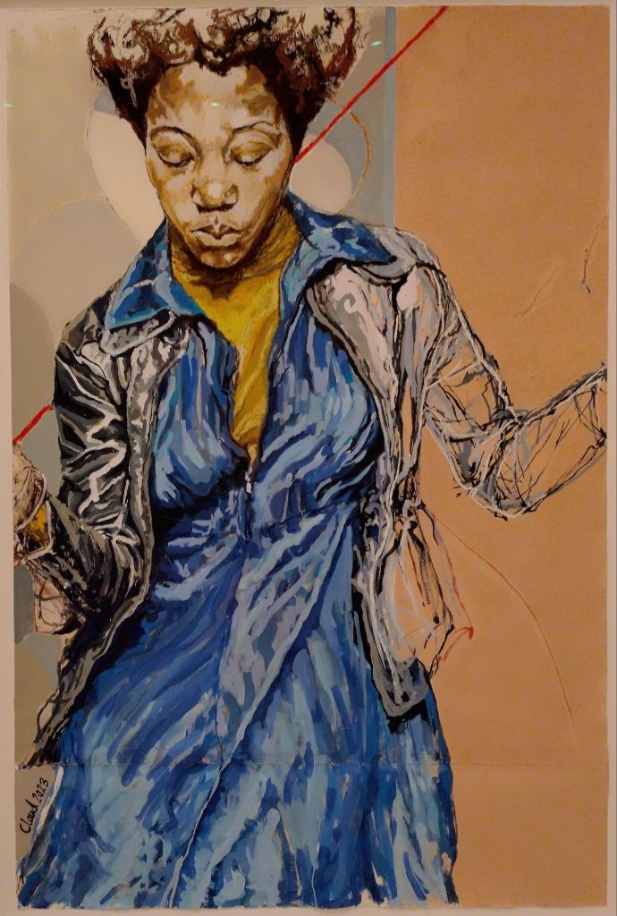 Portrait of a dancing young woman in a blue dress and a dark jacket.